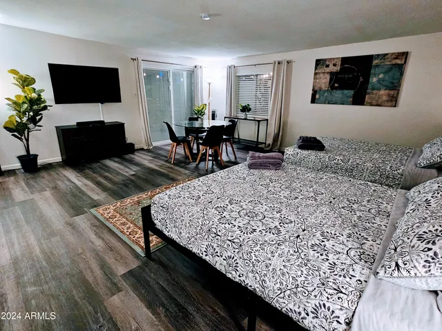 a bedroom with two beds and a window