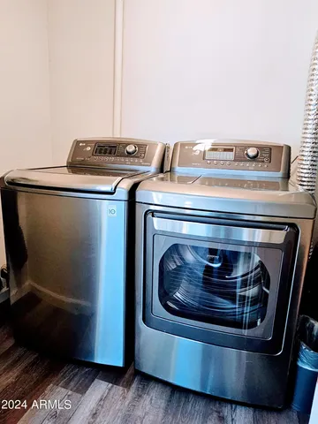 a bedroom with bed and a chandelier