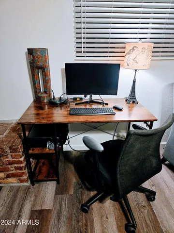 a kitchen with stainless steel appliances kitchen island granite countertop a stove a sink and a refrigerator