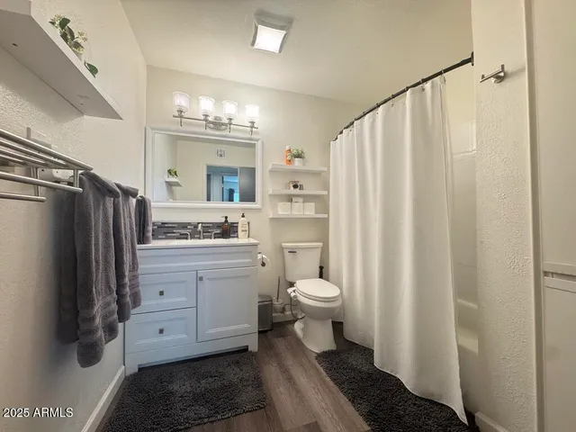 a kitchen with cabinets appliances and a sink