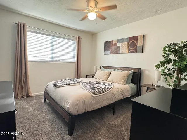 a kitchen with white cabinets stainless steel appliances and center island