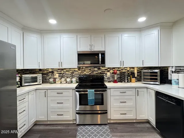 a view of a livingroom with furniture window and wooden floor