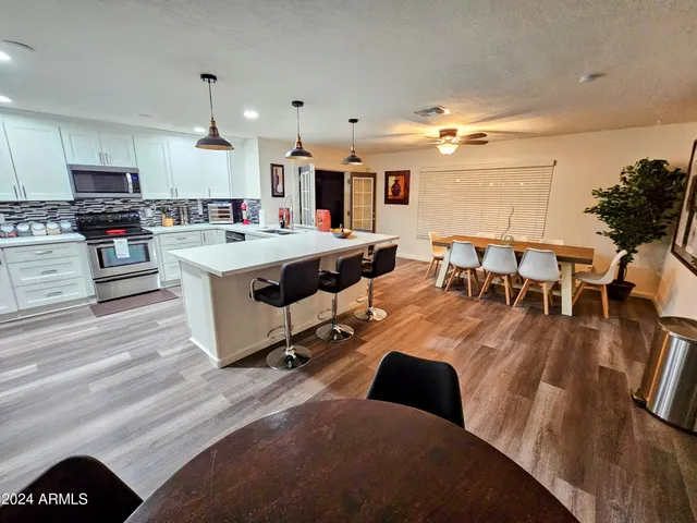 a kitchen that has a lot of cabinets in it