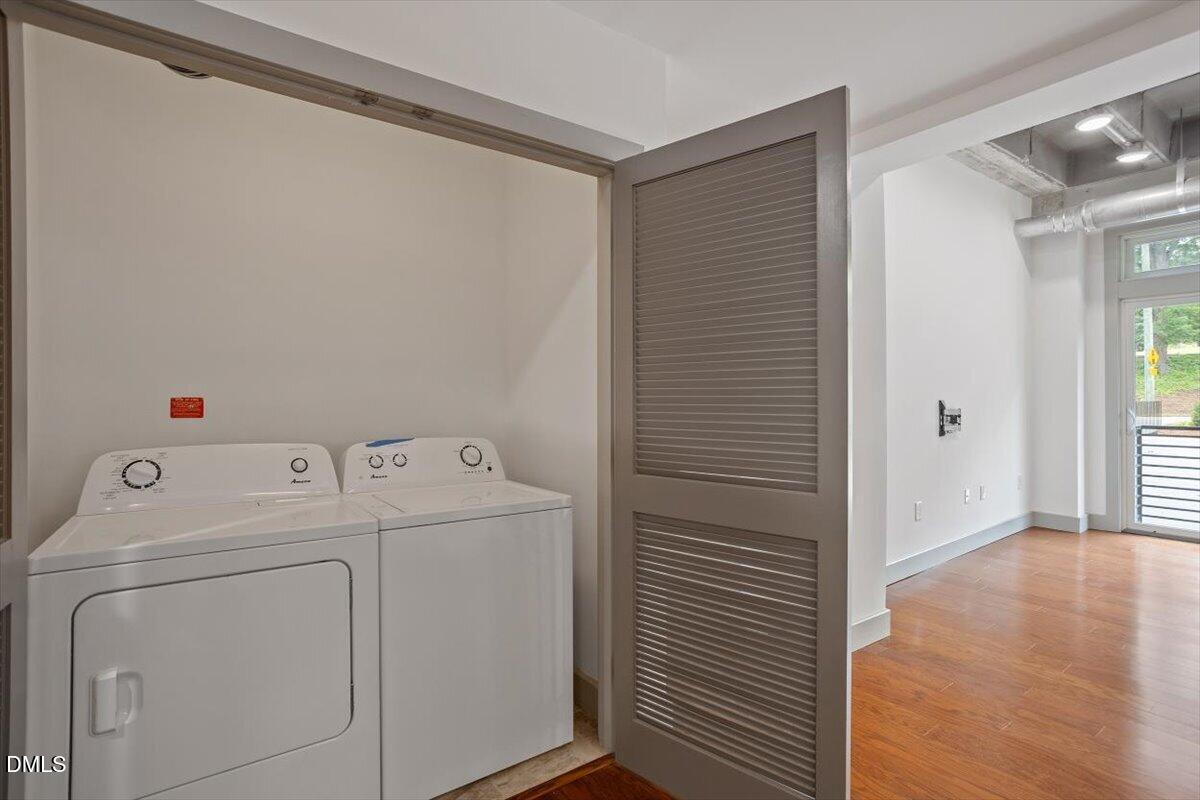 1300 St Marys Street, Unit 207 Raleigh, NC 27605 - Photo 17 of 31 a view of storage and utility room with washer and dryer
