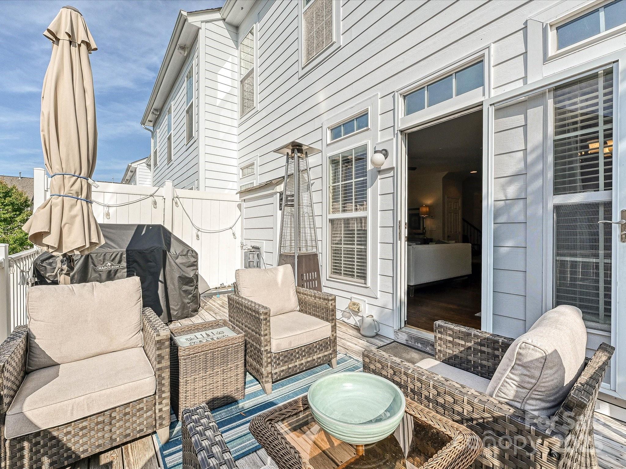 405 Armour Street Davidson, NC 28036 - Photo 15 of 33 a outdoor space with patio the couches and potted plants