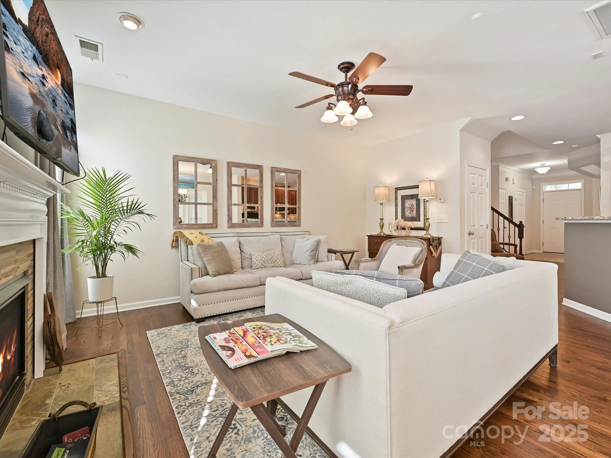 405 Armour Street Davidson, NC 28036 - Photo 17 of 33 a living room with furniture and a fireplace
