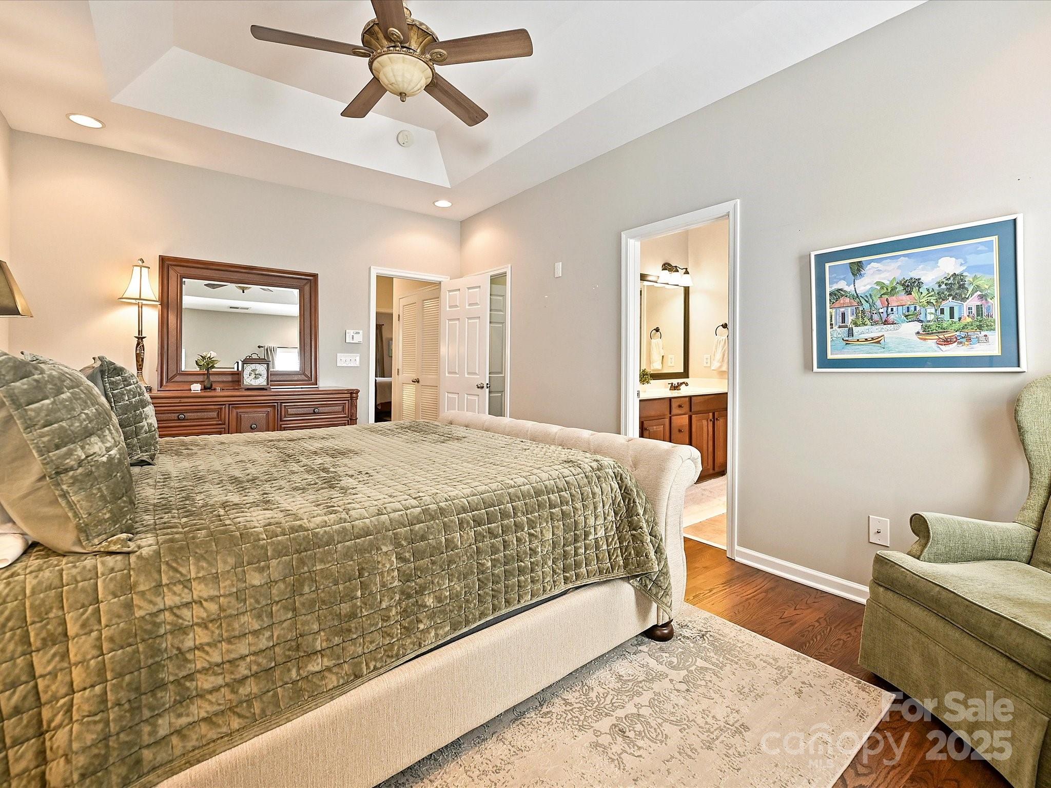 405 Armour Street Davidson, NC 28036 - Photo 21 of 33 a bed sitting in a spacious bedroom next to a window