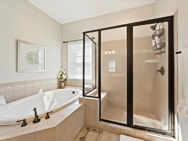 a bathroom with a tub and a sink