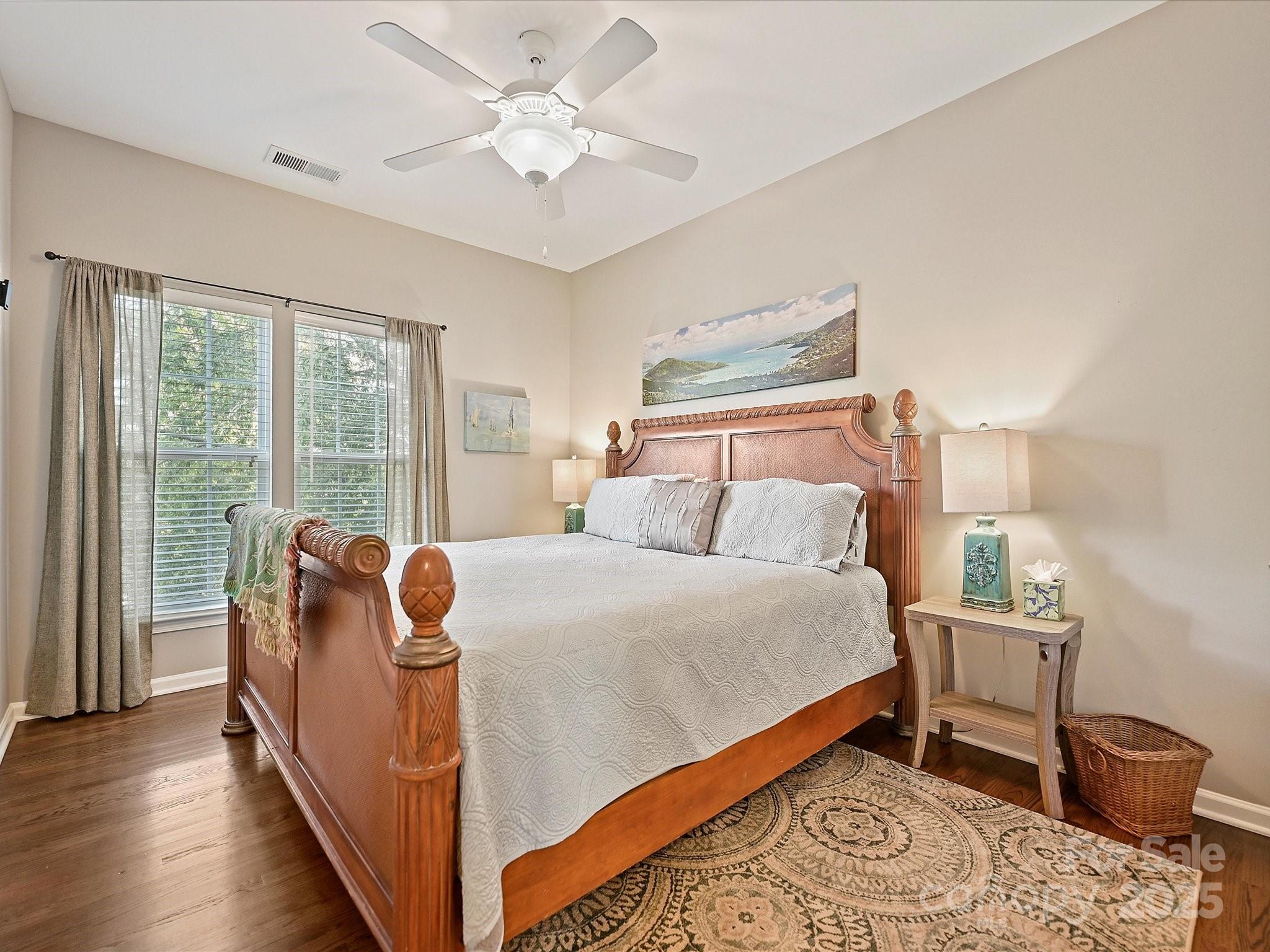 405 Armour Street Davidson, NC 28036 - Photo 24 of 33 a bed room with a bed and a chair