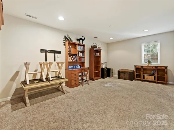 a view of a room with furniture and window