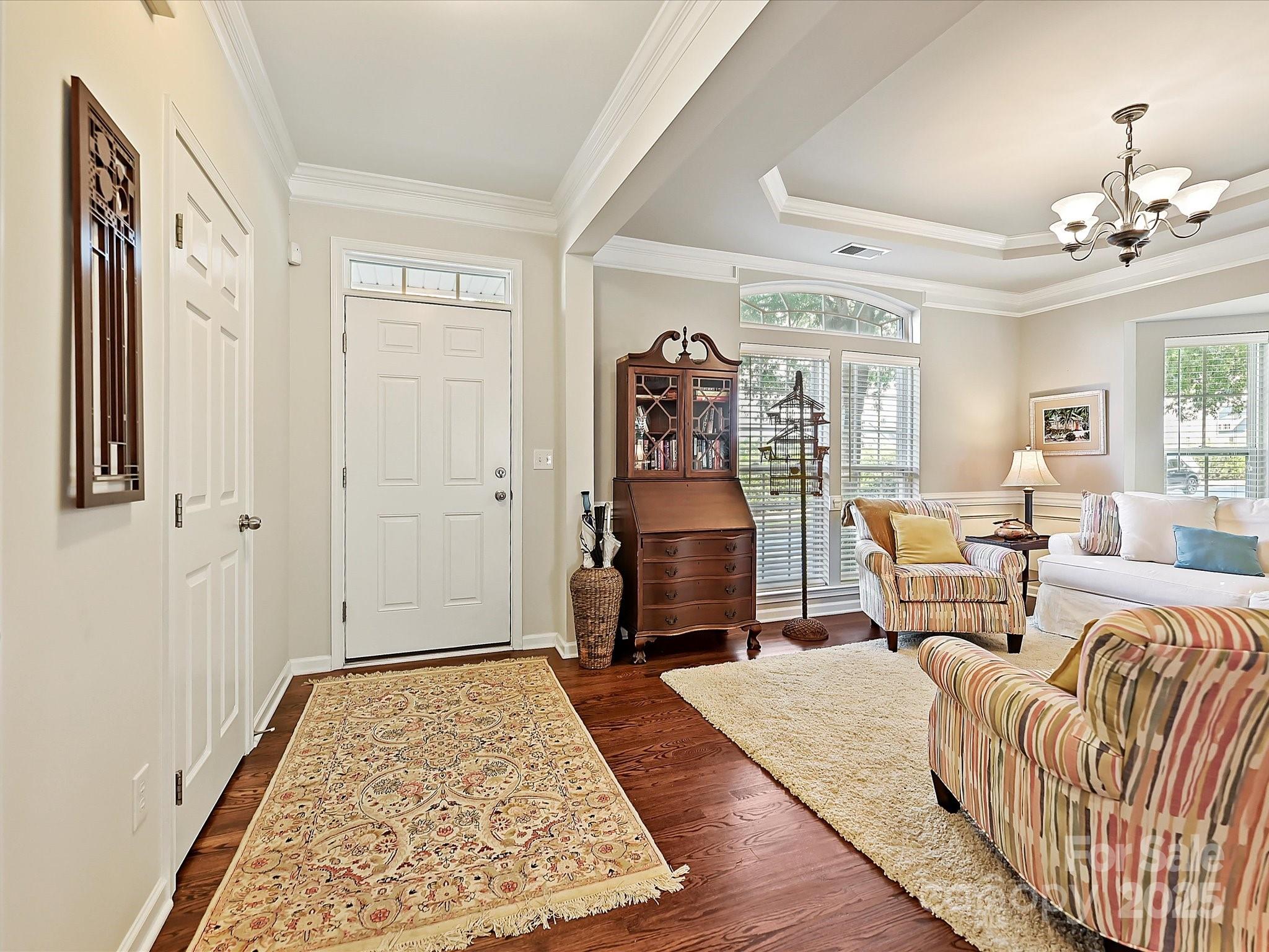 405 Armour Street Davidson, NC 28036 - Photo 3 of 33 a bedroom with furniture and wooden floor