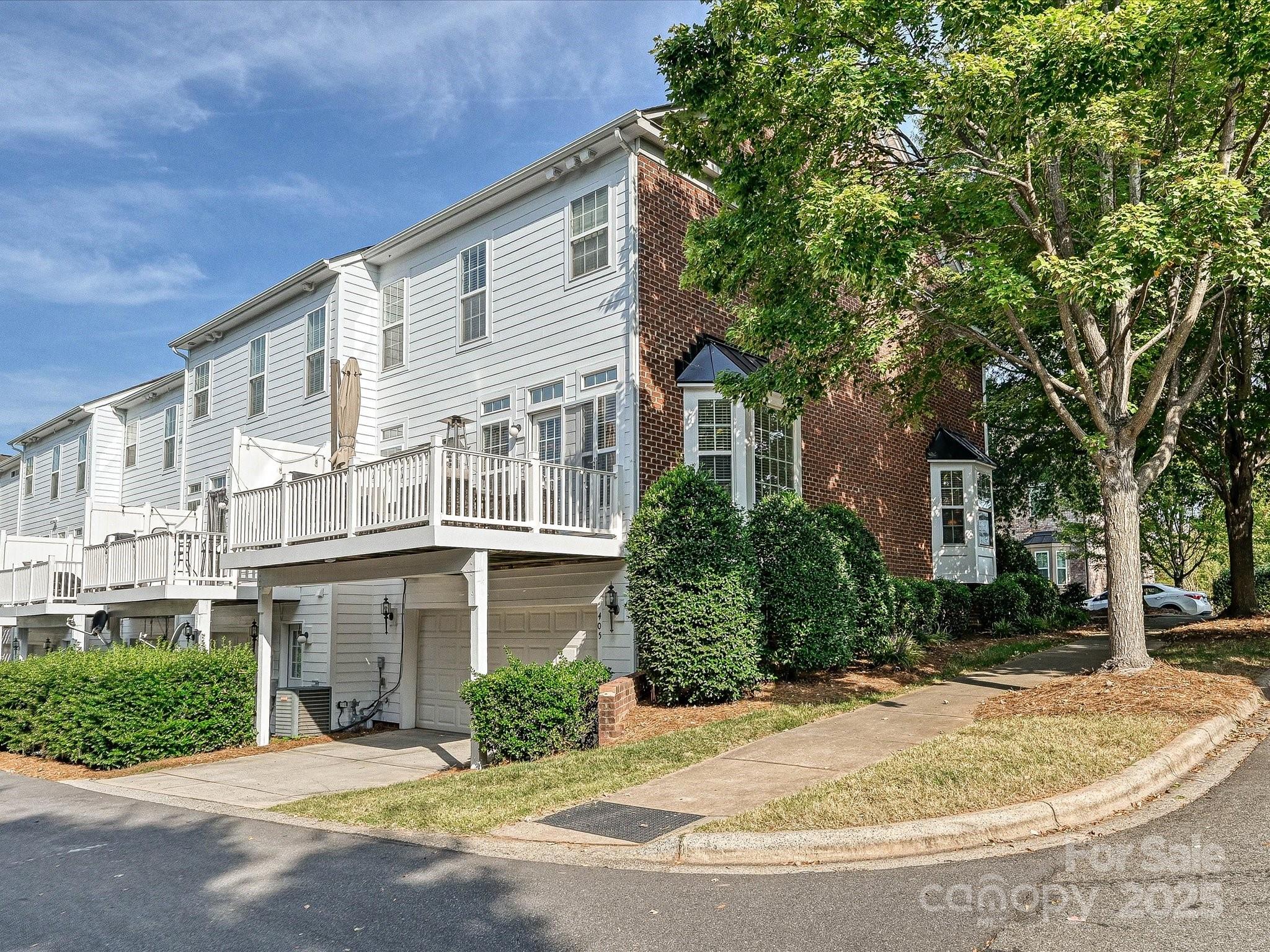 405 Armour Street Davidson, NC 28036 - Photo 31 of 33 a front view of a house with a garden