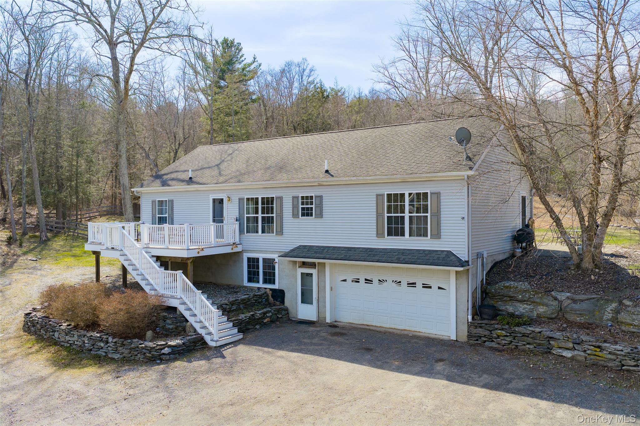 a aerial view of a house with a yard and roof