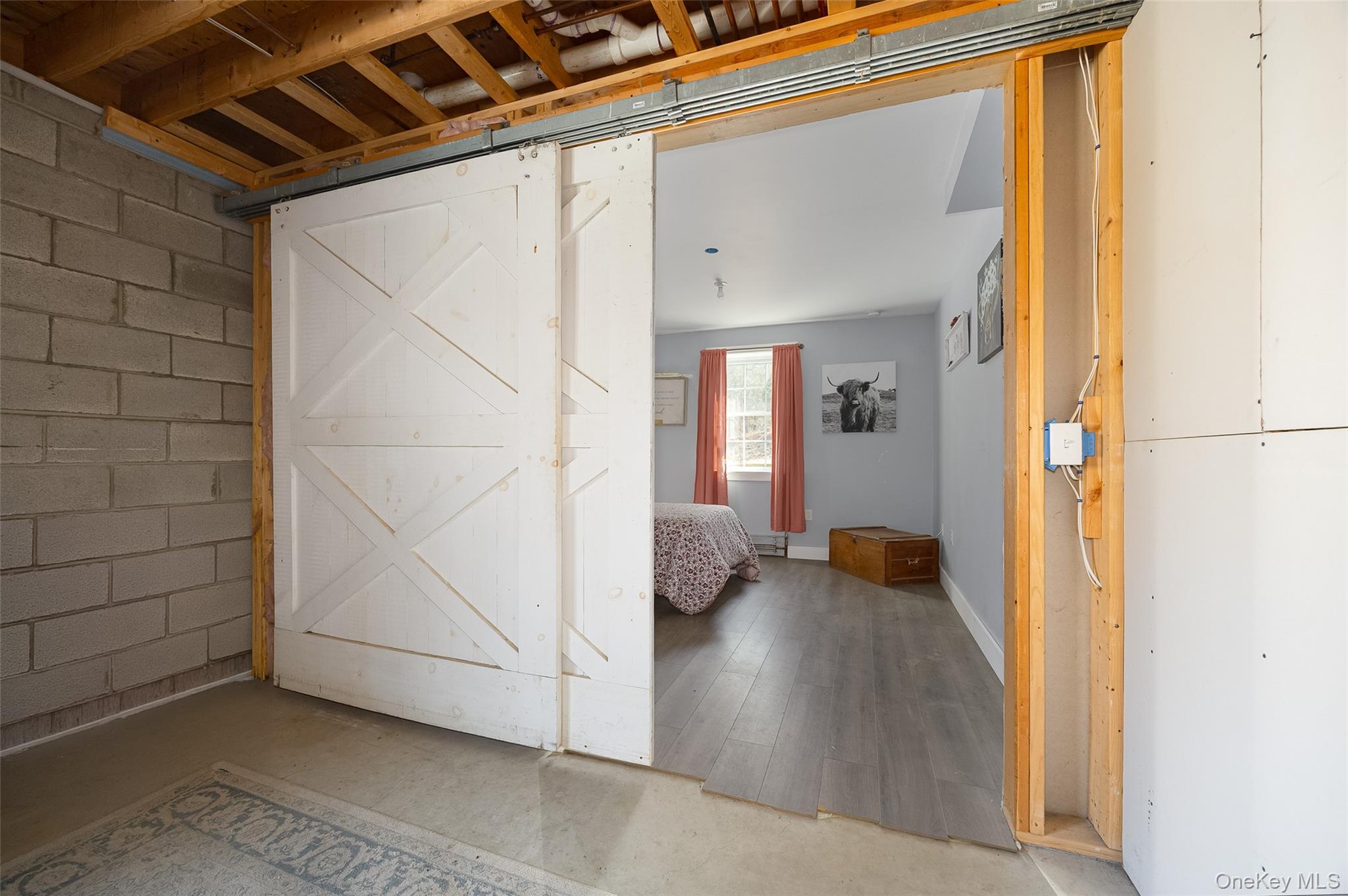 279 Milewood Road Millbrook, NY 12545 - Photo 20 of 33 a view of an empty room with wooden floor and a window