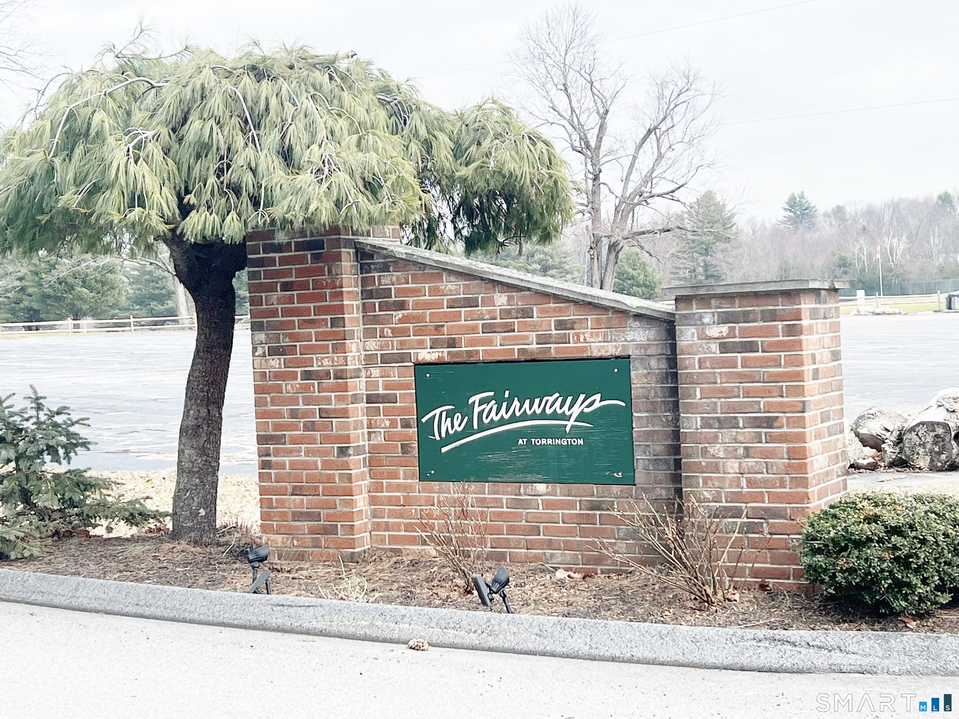 78 Rockledge Loop, Unit 78 Torrington, CT 06790 - Photo 1 of 1 a sign that is on the side of a road