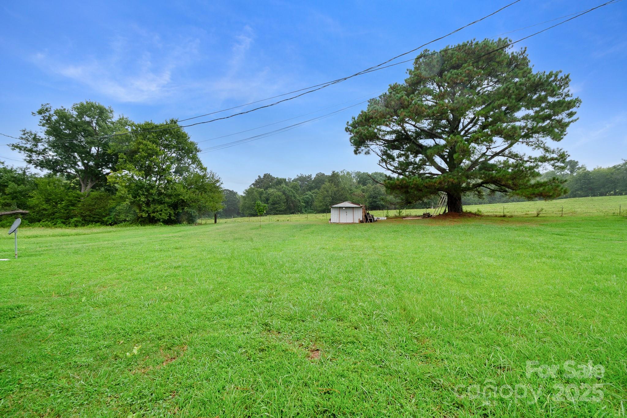 940 West End Road Chester, SC 29706 - Photo 15 of 16 a view of green field with trees in the background