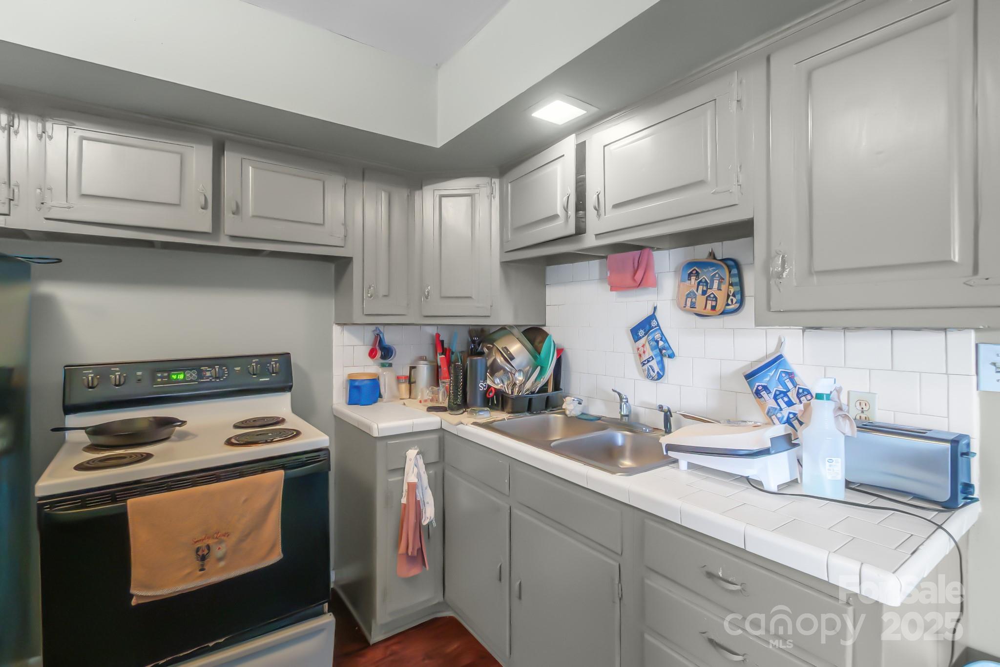 940 West End Road Chester, SC 29706 - Photo 6 of 16 a kitchen with stainless steel appliances granite countertop a sink stove and cabinets