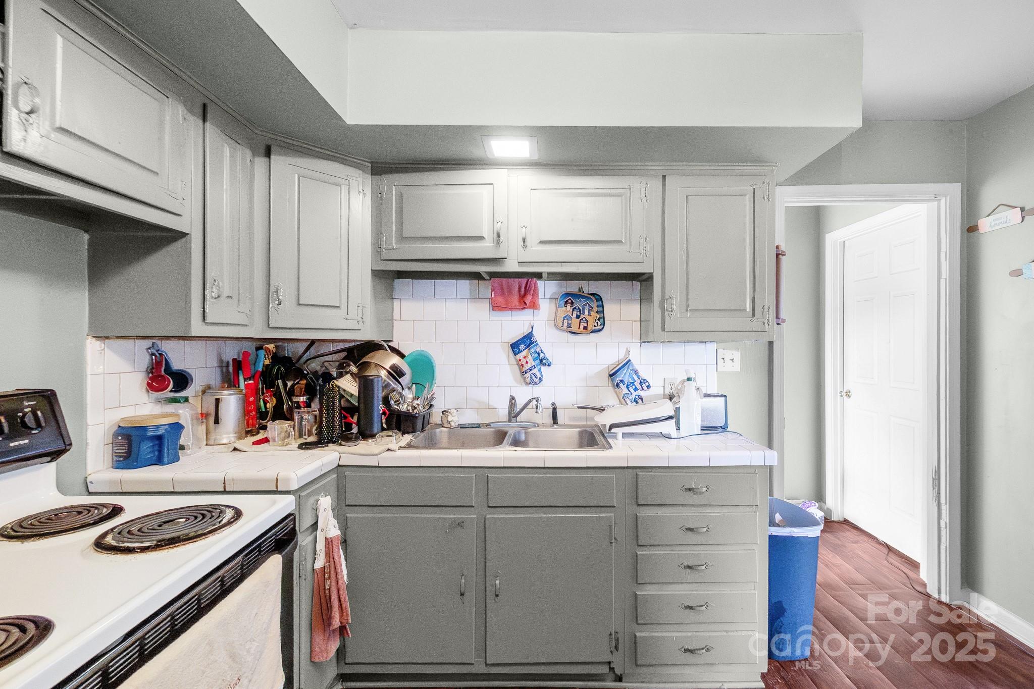 940 West End Road Chester, SC 29706 - Photo 7 of 16 a kitchen with white cabinets and appliances