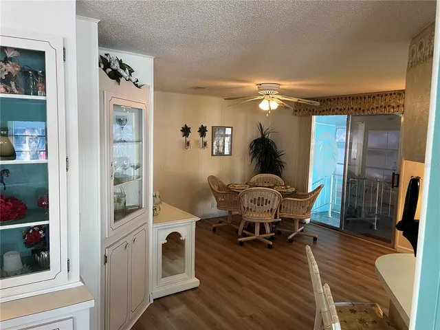 a workspace with wooden floor and furniture