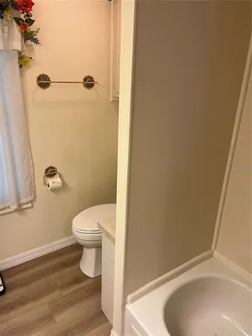 a bathroom with a toilet and a sink