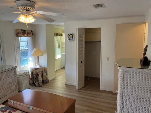 a view of a room with wooden floor and staircase