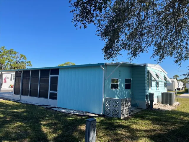 a view of house with yard