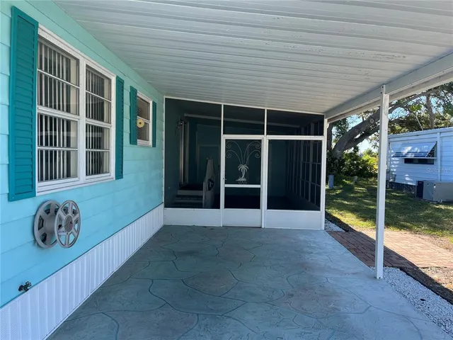 a view of porch with a stove and balcony
