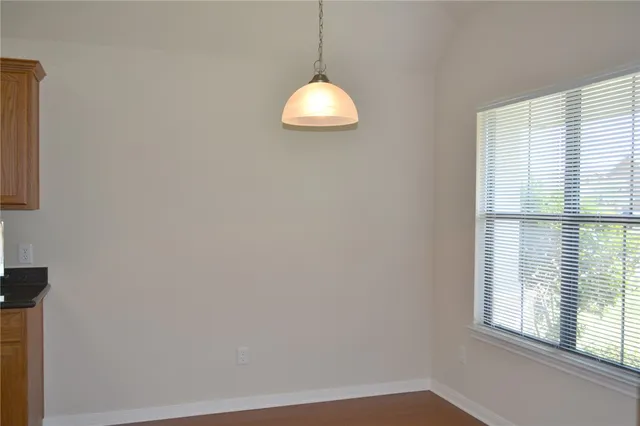 a room with window and a ceiling fan