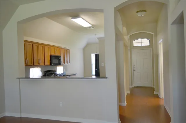 a bathroom with a sink a mirror and a vanity