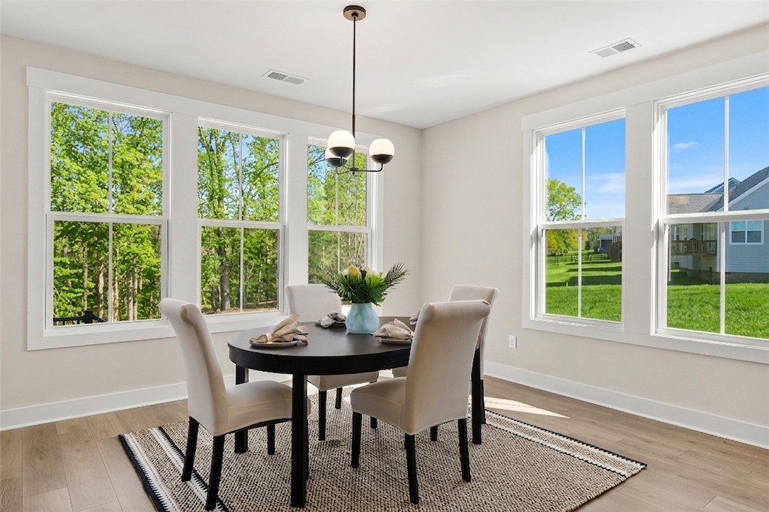 334 Summerall Drive Anderson, SC 29621 - Photo 24 of 28 This bright dining area offers abundant natural light and scenic views of lush greenery.