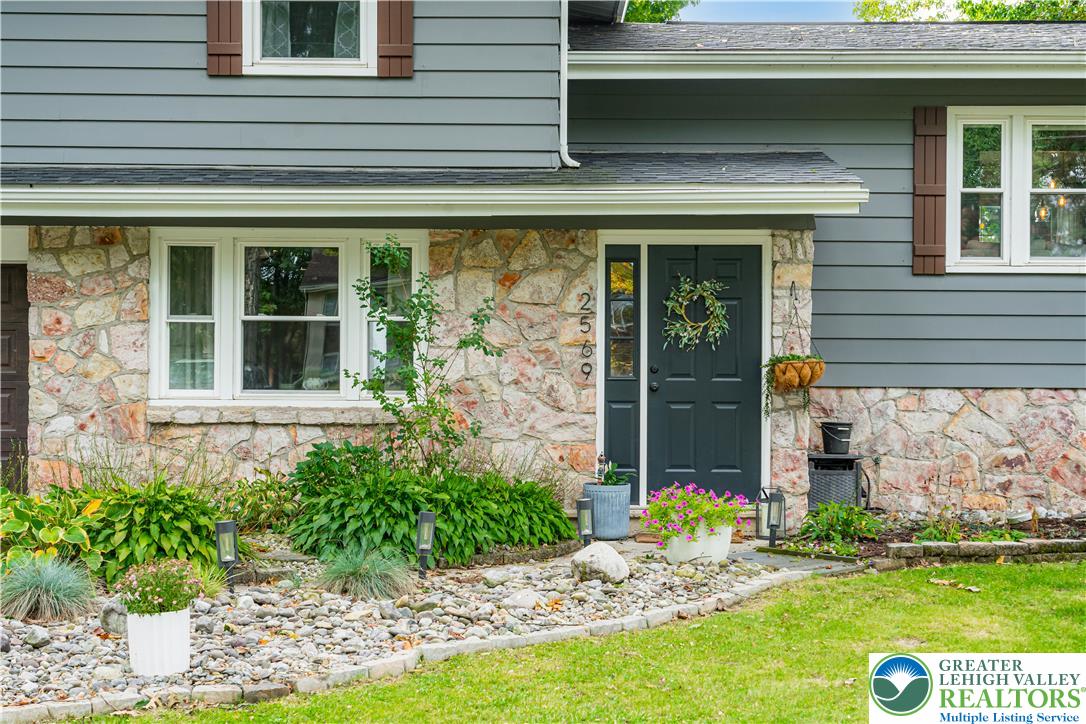 2569 Woods Edge Road Bath, PA 18014 - Photo 29 of 40 Natural stone accents and classic siding create an inviting entrance with timeless curb appeal.