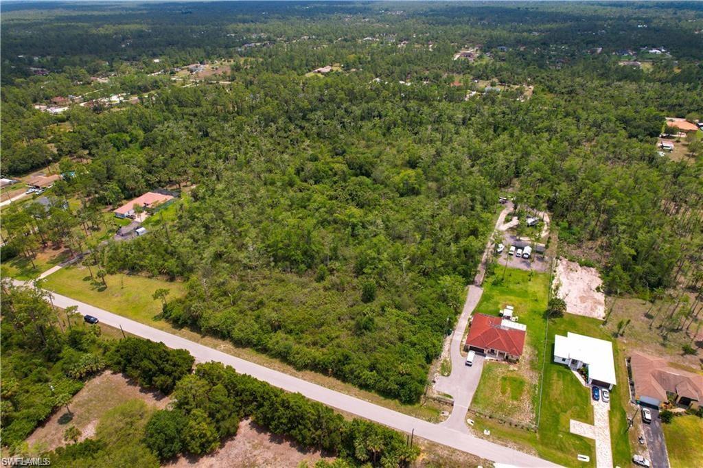 0 14th Avenue Northeast Naples, FL 34102 - Photo 2 of 3 Aerial view of property and surrounding area featuring a heavily wooded area