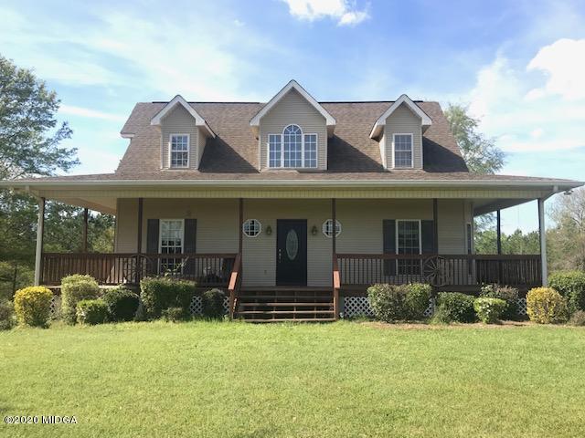 174 Rifle Range Road Gray, GA 31032 - Photo 1 of 39 a front view of a house with garden