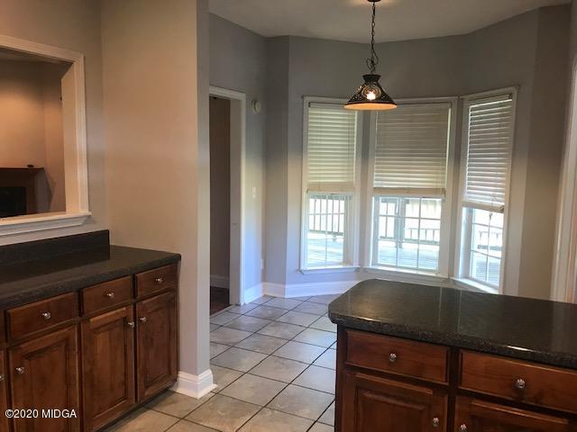 174 Rifle Range Road Gray, GA 31032 - Photo 11 of 39 a living room with furniture and a flat screen tv