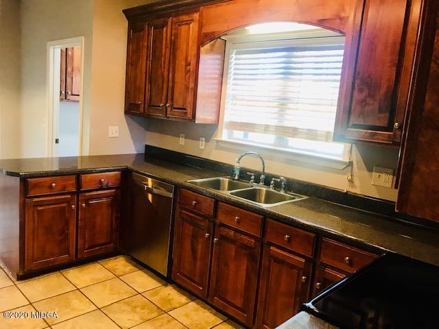 174 Rifle Range Road Gray, GA 31032 - Photo 13 of 39 a kitchen with granite countertop cabinets sink and window