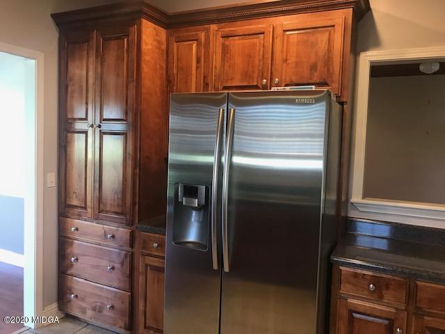 174 Rifle Range Road Gray, GA 31032 - Photo 15 of 39 a kitchen with a refrigerator and countertop