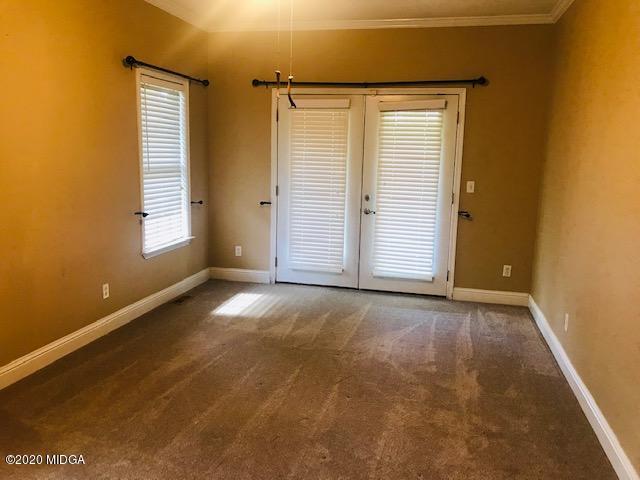 174 Rifle Range Road Gray, GA 31032 - Photo 17 of 39 an empty room with windows