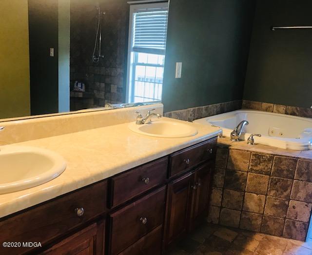 174 Rifle Range Road Gray, GA 31032 - Photo 19 of 39 a bathroom with a sink and a bathtub
