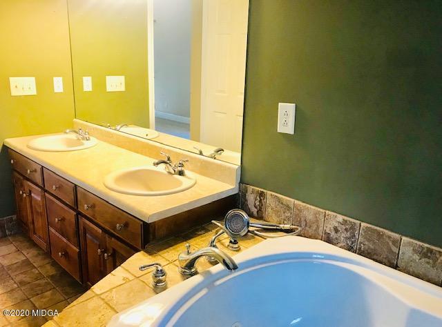 174 Rifle Range Road Gray, GA 31032 - Photo 20 of 39 a bathroom with a sink and a mirror