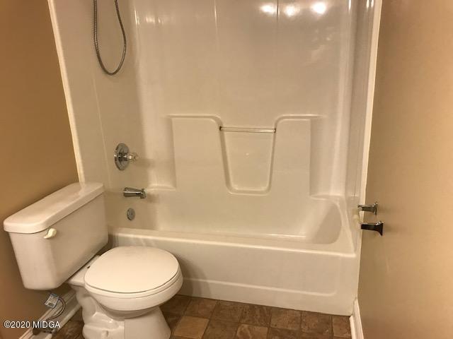 174 Rifle Range Road Gray, GA 31032 - Photo 23 of 39 a bathroom with a toilet and a shower