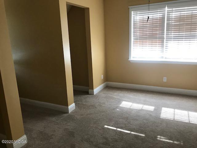 174 Rifle Range Road Gray, GA 31032 - Photo 25 of 39 an empty room with windows