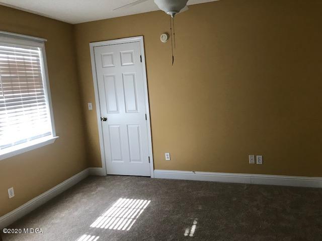 174 Rifle Range Road Gray, GA 31032 - Photo 26 of 39 an empty room with windows