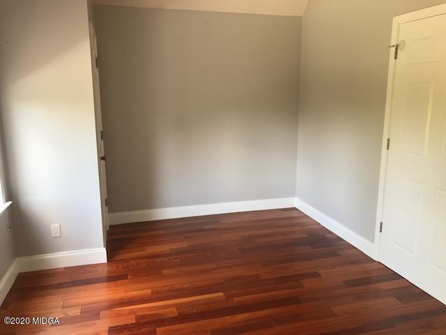 174 Rifle Range Road Gray, GA 31032 - Photo 28 of 39 a view of an empty room with wooden floor