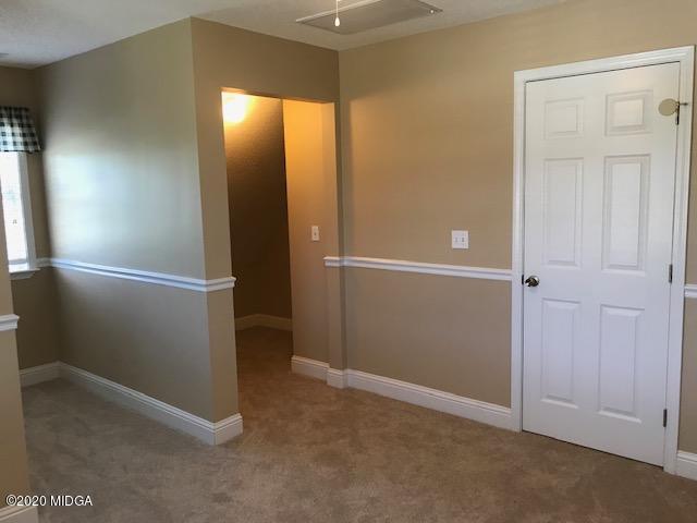 174 Rifle Range Road Gray, GA 31032 - Photo 29 of 39 an empty room with windows