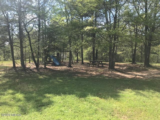 174 Rifle Range Road Gray, GA 31032 - Photo 4 of 39 a view of a park with large trees