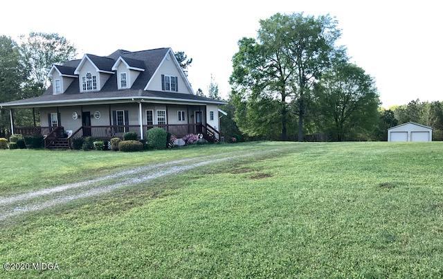 174 Rifle Range Road Gray, GA 31032 - Photo 39 of 39 a view of a big house with a big yard and large trees