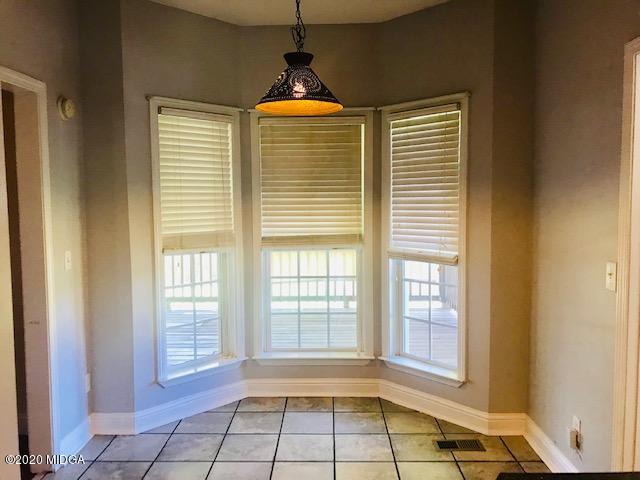 174 Rifle Range Road Gray, GA 31032 - Photo 8 of 39 a view of an empty room with a window