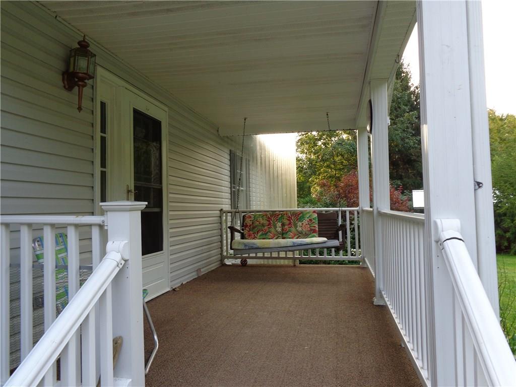 1047 Springfield Road Mercer, PA 16127 - Photo 14 of 25 relax on the front porch swing