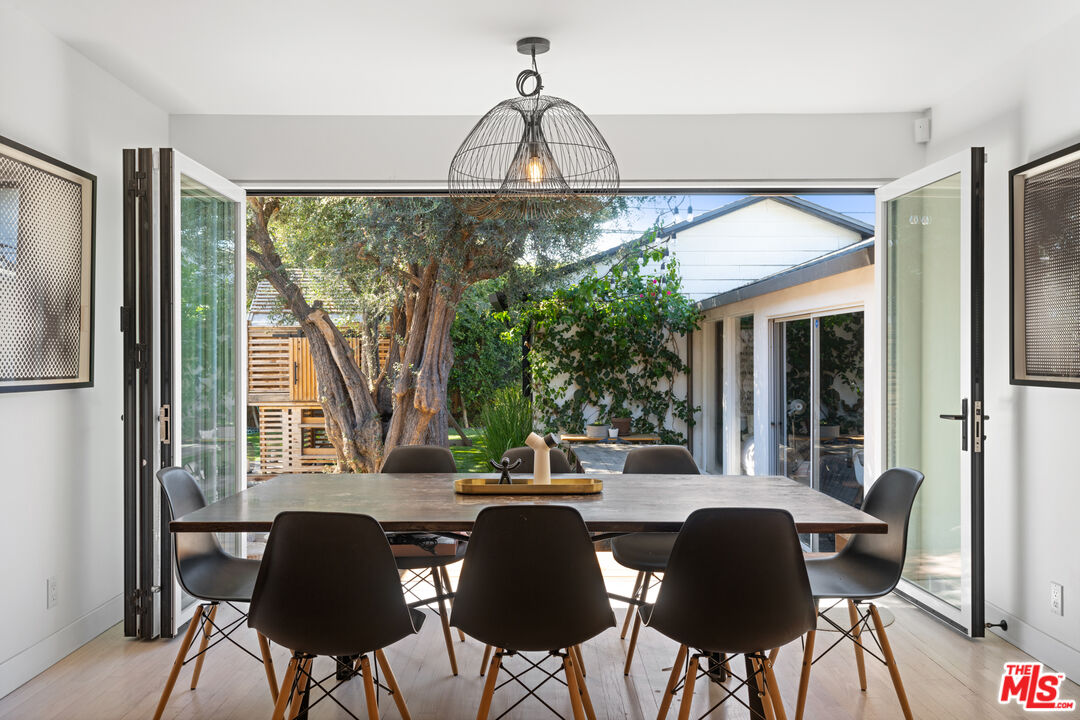3301 McLaughlin Avenue Los Angeles, CA 90066 - Photo 2 of 46 a view of a dining room with furniture window and outside view
