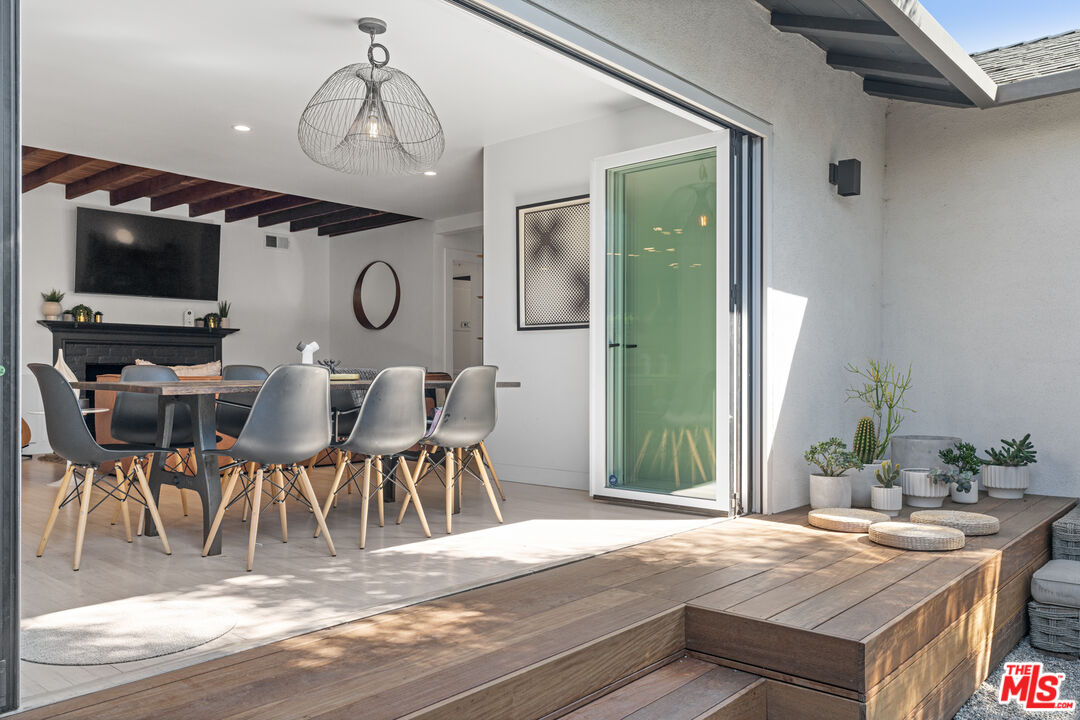 3301 McLaughlin Avenue Los Angeles, CA 90066 - Photo 13 of 46 a view of a dining room with furniture and wooden floor